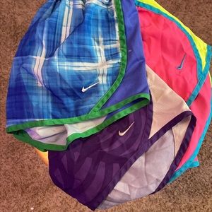 3 Nike dry-fit shorts blue is M purple and pink are L